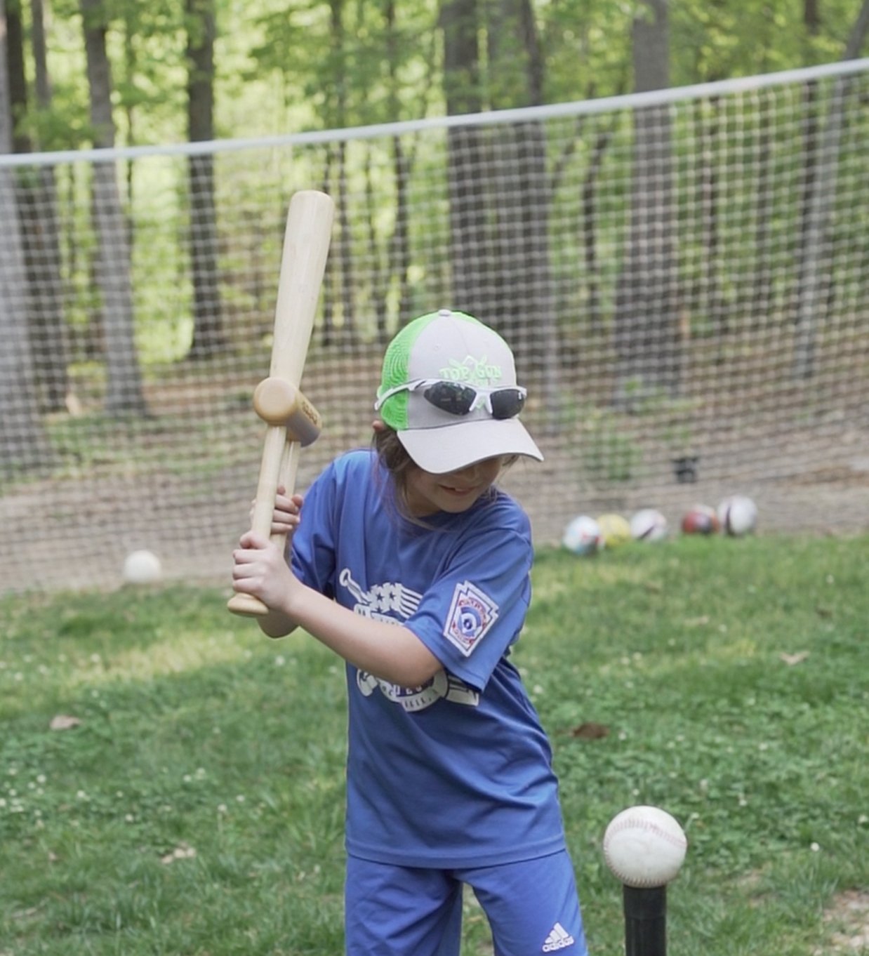 Sequence Bat hitting stick teaches proper swing mechanics for youth softball players in Little League